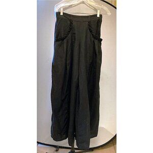 Black linen-blend pant-skirt with elastic back waist and bias trim design on poc